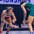 Maddie Avila, left, a women’s wrestler at North Central (Illinois), competes in a match during the 2022-23 season.