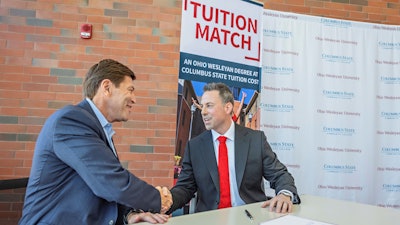 President Dr. David Harrison (left) of Columbus State Community College and President Dr. Matt vandenBerg of Ohio Wesleyan University shake hands after signing a landmark agreement April 18 at Columbus State’s Delaware Campus. The agreement improves affordability and accessibility for qualified Columbus State graduates who want to complete their bachelor’s degrees at Ohio Wesleyan.